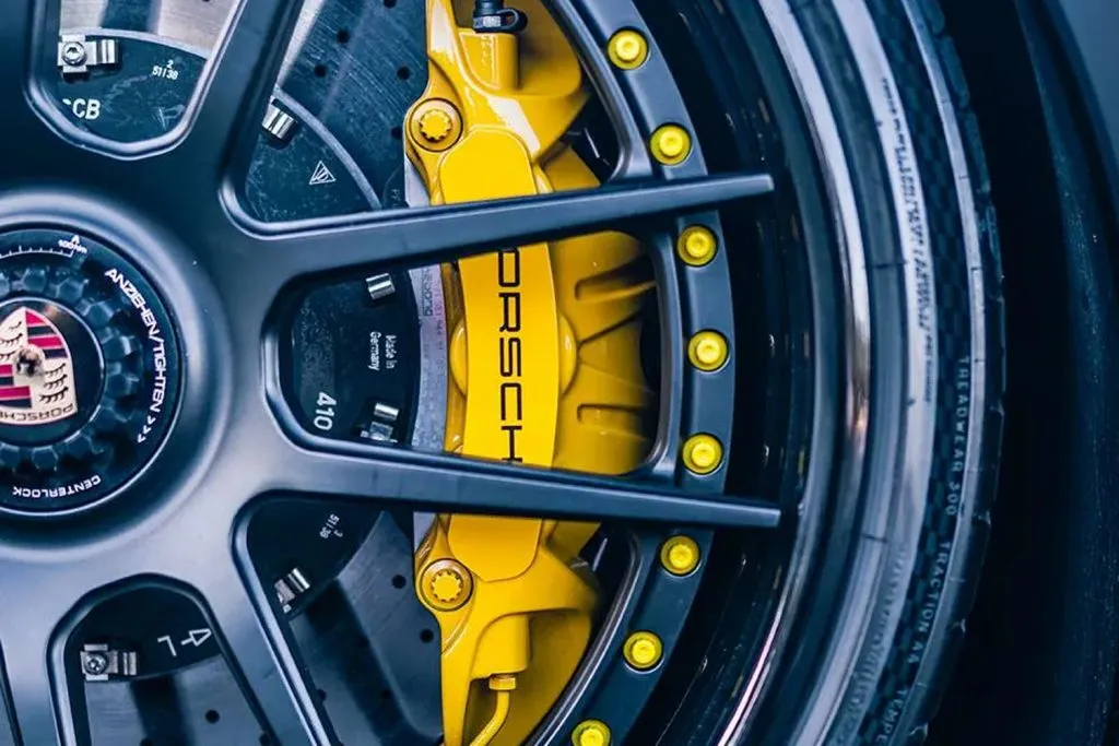Porsche brake caliper painted yellow