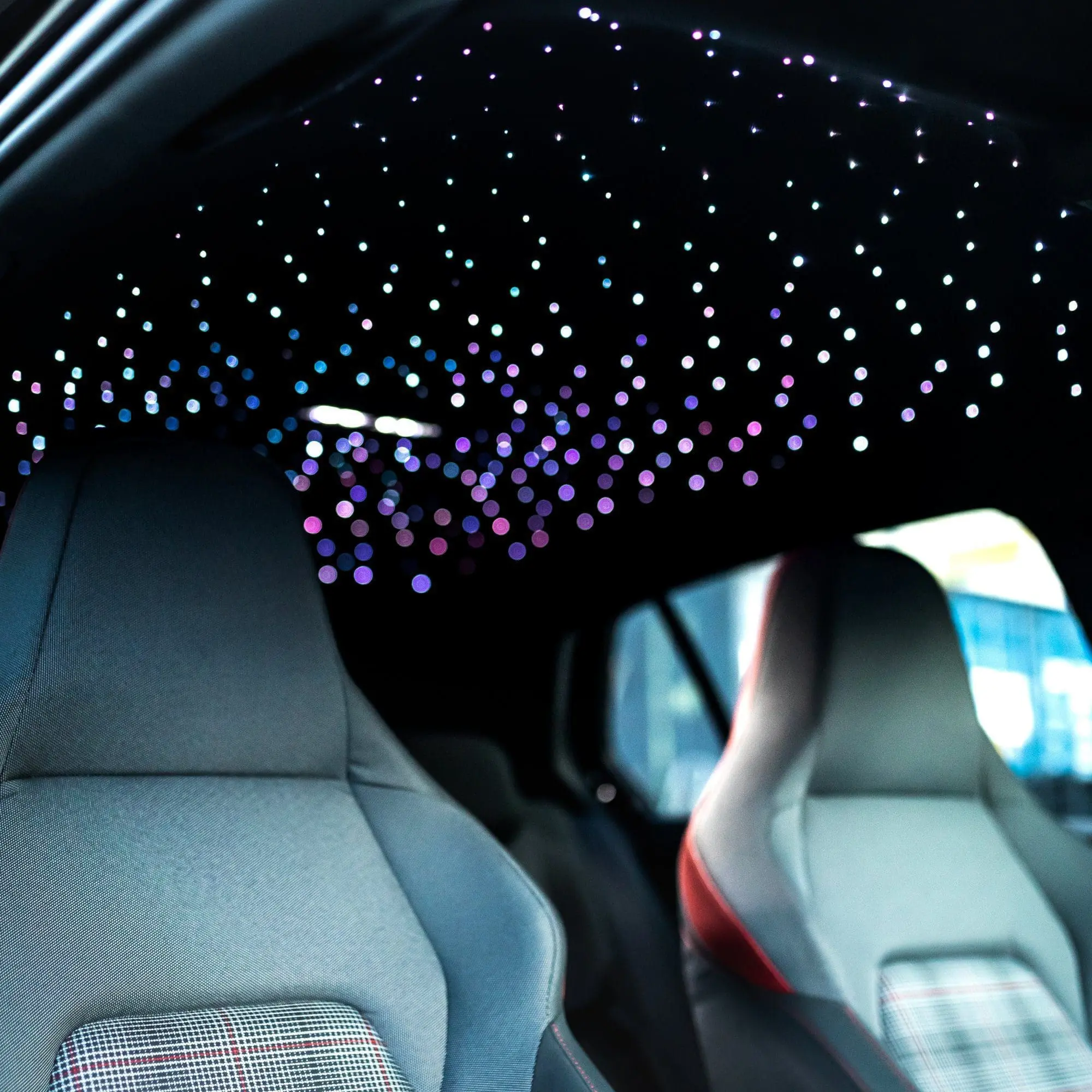 Fiber optic starlight headliner installed in a car interior